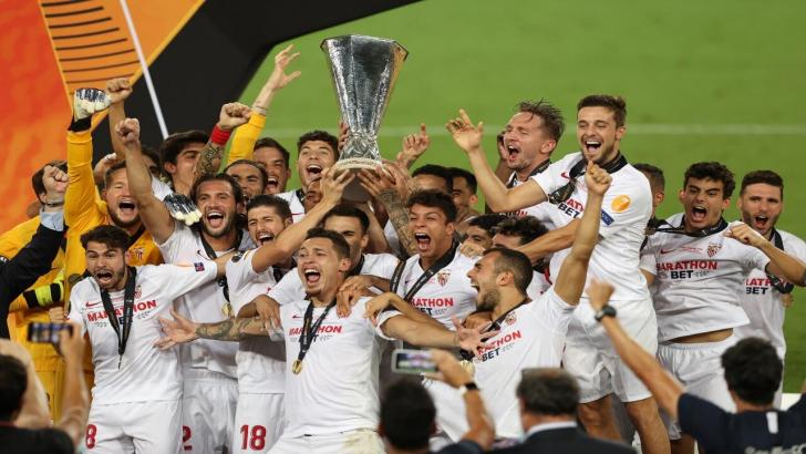 Sevilla players lift the Europa League trophy